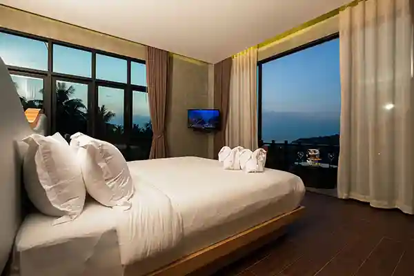 Jacuzzi King Suite Night View in Koh Tao Jacuzzi King Suite bedroom with evening sea view in Koh Tao