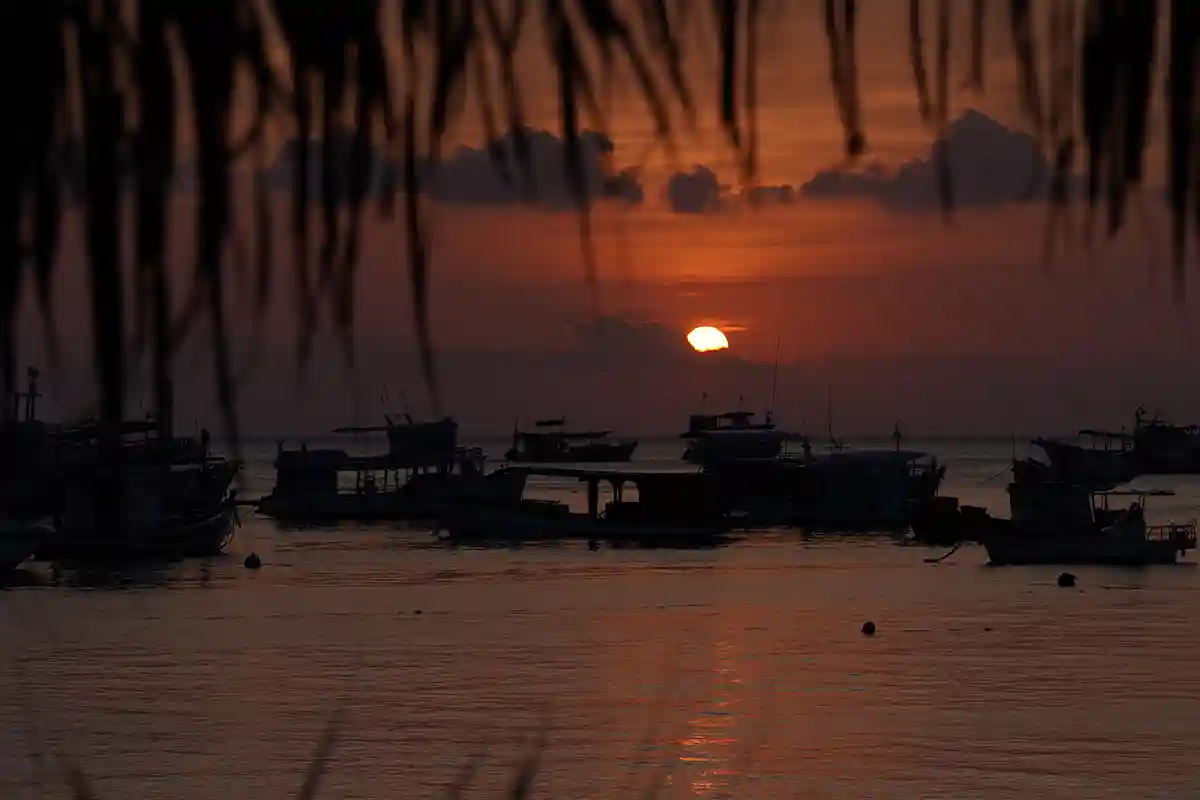 Sunset Before a Night Dive in Koh Tao Sunset over Koh Tao from a dive boat before a night dive