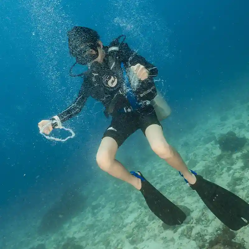 PADI Advanced Open Water Buoyancy Dive in Koh Tao Advanced Open Water student practising buoyancy control above the reef in Koh Tao