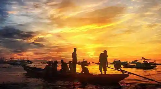 PADI Night Diver Course in Koh Tao Longtail boats at sunset in Koh Tao before a night diving trip