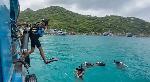 PADI Scuba Diver Giant-Stride Entry in Koh Tao Student making a giant-stride entry during a PADI Scuba Diver Course in Koh Tao