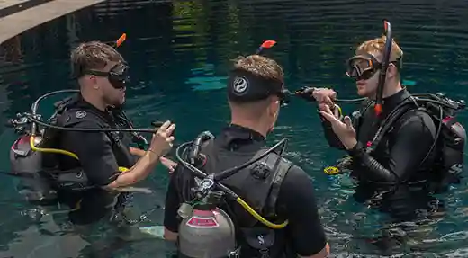Scuba Refresher in Koh Tao Three certified divers refreshing their scuba skills in the pool at Flow Divers Koh Tao