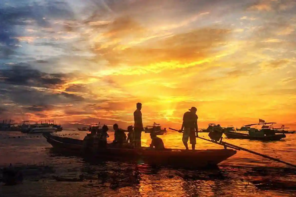 Setting Off for a Koh Tao Night Dive Dive boat preparing to depart at sunset in Koh Tao